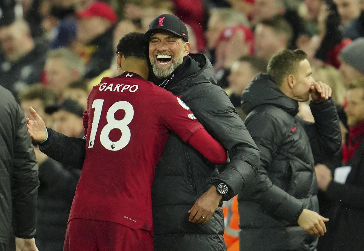 Liverpool’s manager Jurgen Klopp celebrates with Liverpool’s Cody Gakpo
