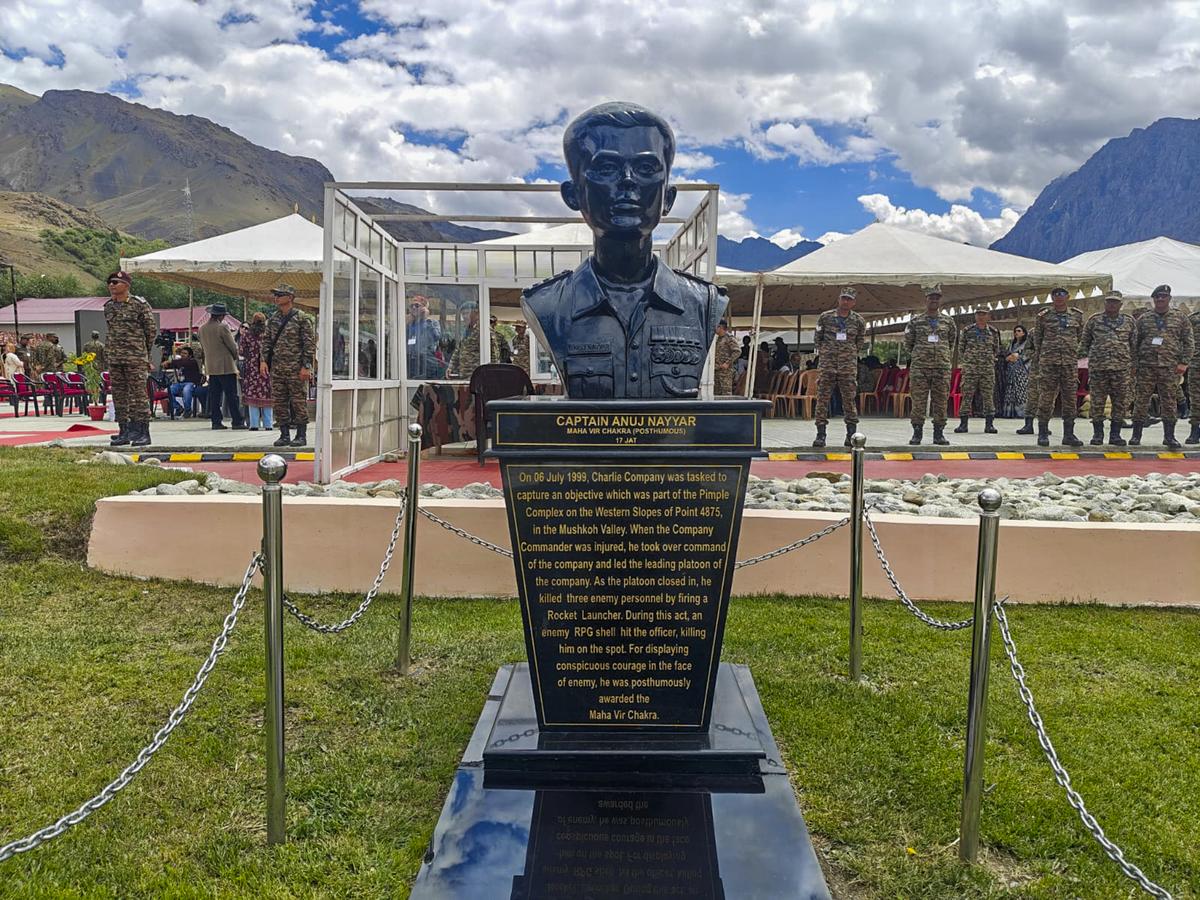 Security personnel keep vigil near the bust of late captain Anuj Nayyar, who was martyred in the Kargil War, on the 26th anniversary of the Kargil Vijay Diwas, at the Kargil War Memorial at Drass, on July 26, 2025.