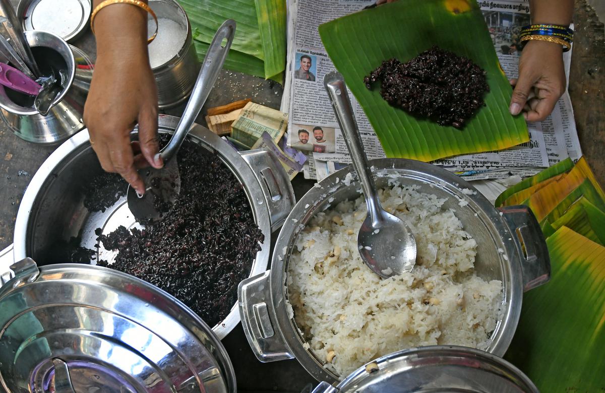 Black sticky rice, which is pressure-cooked with lobia beans and served with a topping of grated coconut and country sugar.