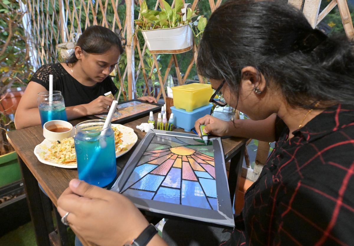People engrossed in different art activity at Artgram, an initiative to promote various kinds of DIY art activities, at a cafe in Visakhapatnam. People engrossed in different art activity at Artgram, an initiative to promote various kinds of DIY art activities, at a cafe in Visakhapatnam.