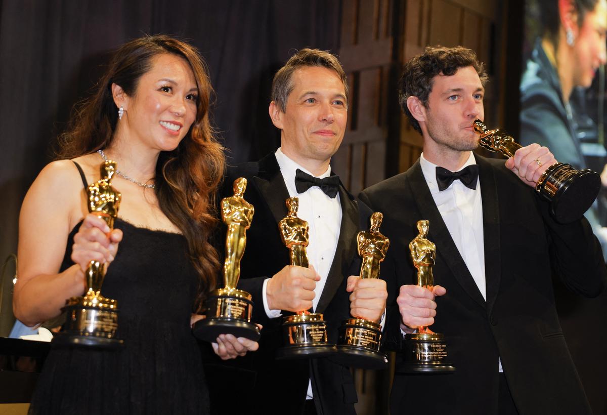 Director Sean Baker and producers Alex Coco and Samantha Quan pose with the Oscars for “Anora” during the Governors Ball following the Oscars show at the 97th Academy Awards in Hollywood