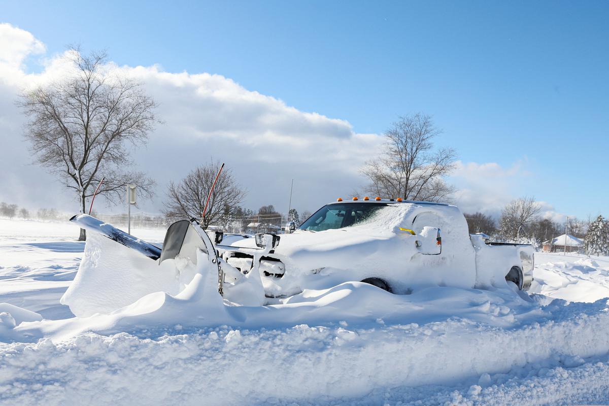 A snow plow is left stranded on the road following a winter storm that hit the Buffalo region on Main St. in Amherst, New York, U.S., on December 25, 2022.