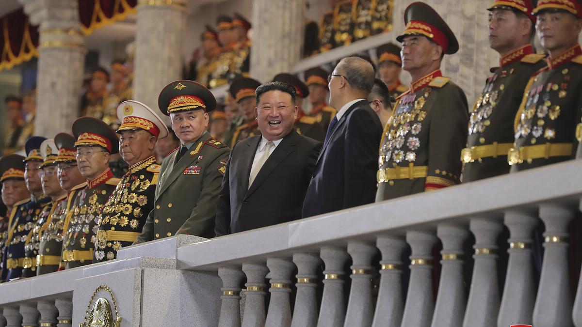 Russian and Chinese delegates join North Korean leader Kim at a parade showing his newest missiles