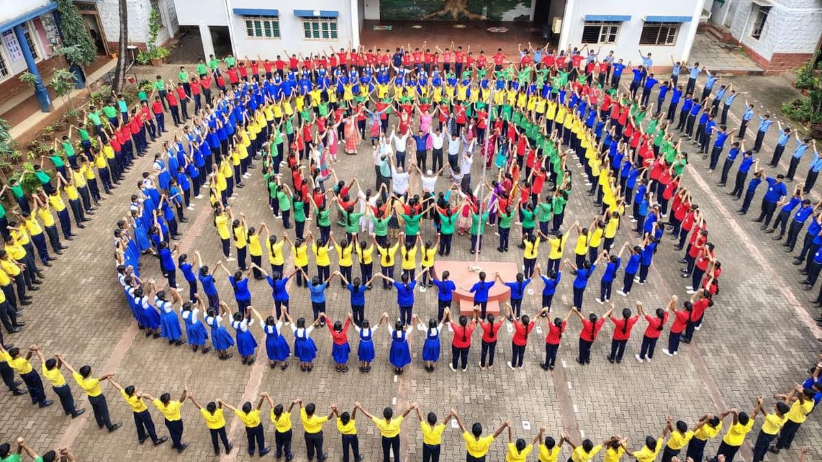 Participants hold hands to form an unbroken human chain across dists., read the Preamble