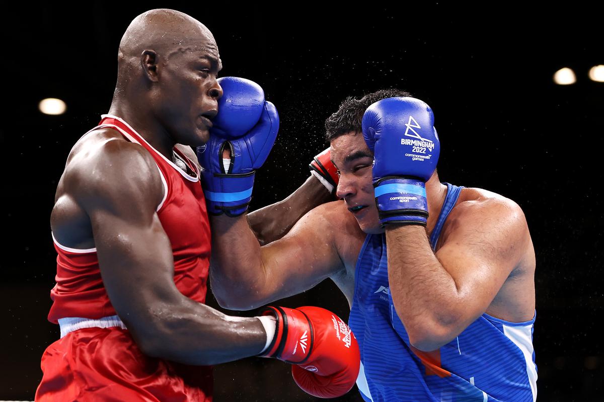 Take that! India’s Sagar Ahlawat, right, makes his punch count against Cameroon’s Maxime Yegnong Njieyo in the men’s over 92kg (super heavyweight) round of 16 bout on day three of the Birmingham 2022 Commonwealth Games at the NEC Arena on July 31, 2022.