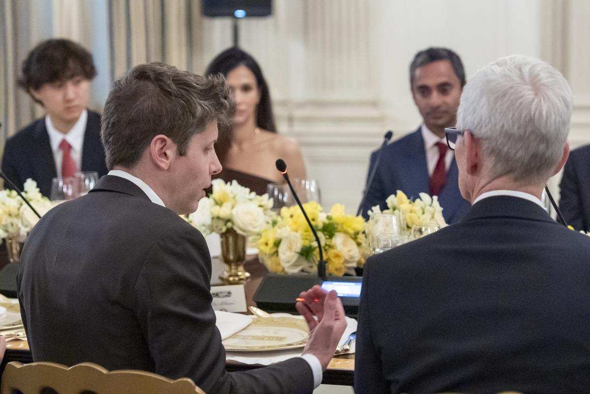 Sam Altman, CEO of OpenAI, left, speaks, with Tim Cook, CEO of Apple, during a dinner with President Donald Trump in the State Dinning Room of the White House, Thursday, Sept. 4, 2025, in Washington. (AP Photo/Alex Brandon) Sam Altman, CEO of OpenAI, left, speaks, with Tim Cook, CEO of Apple, during a dinner with President Donald Trump in the State Dinning Room of the White House, Thursday, Sept. 4, 2025, in Washington. (AP Photo/Alex Brandon)