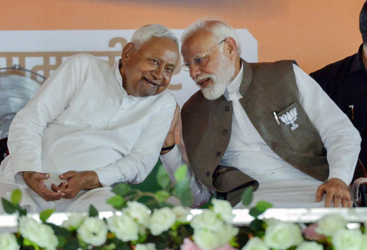 Prime Minister Narendra Modi and Bihar Chief Minister Nitish Kumar Yadav interact during Bihar assembly elections rally, in Samastipur Prime Minister Narendra Modi and Bihar Chief Minister Nitish Kumar Yadav interact during Bihar assembly elections rally, in Samastipur
