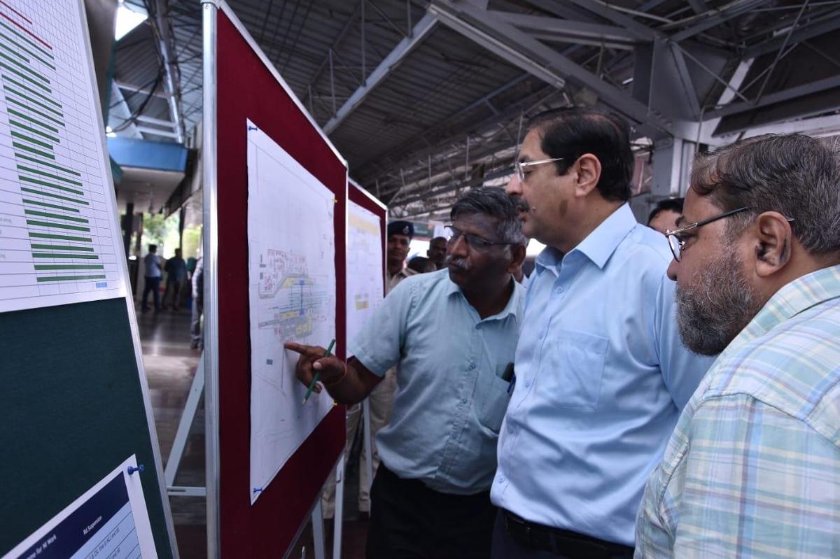 Officials explaining about station redevelopment works underway at Tirunelveli railway station to Southern Railway General Manager R.N. Singh on Wednesday.