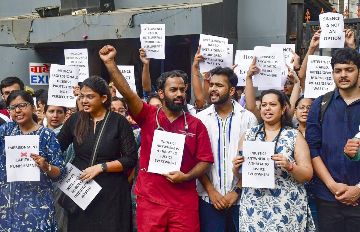 Doctors and medical students protest against the sexual assault and killing of a Kolkata based post-graduate trainee doctor, at Nair Hospital in Mumbai, Tuesday, August 13, 2024 Doctors and medical students protest against the sexual assault and killing of a Kolkata based post-graduate trainee doctor, at Nair Hospital in Mumbai, Tuesday, August 13, 2024