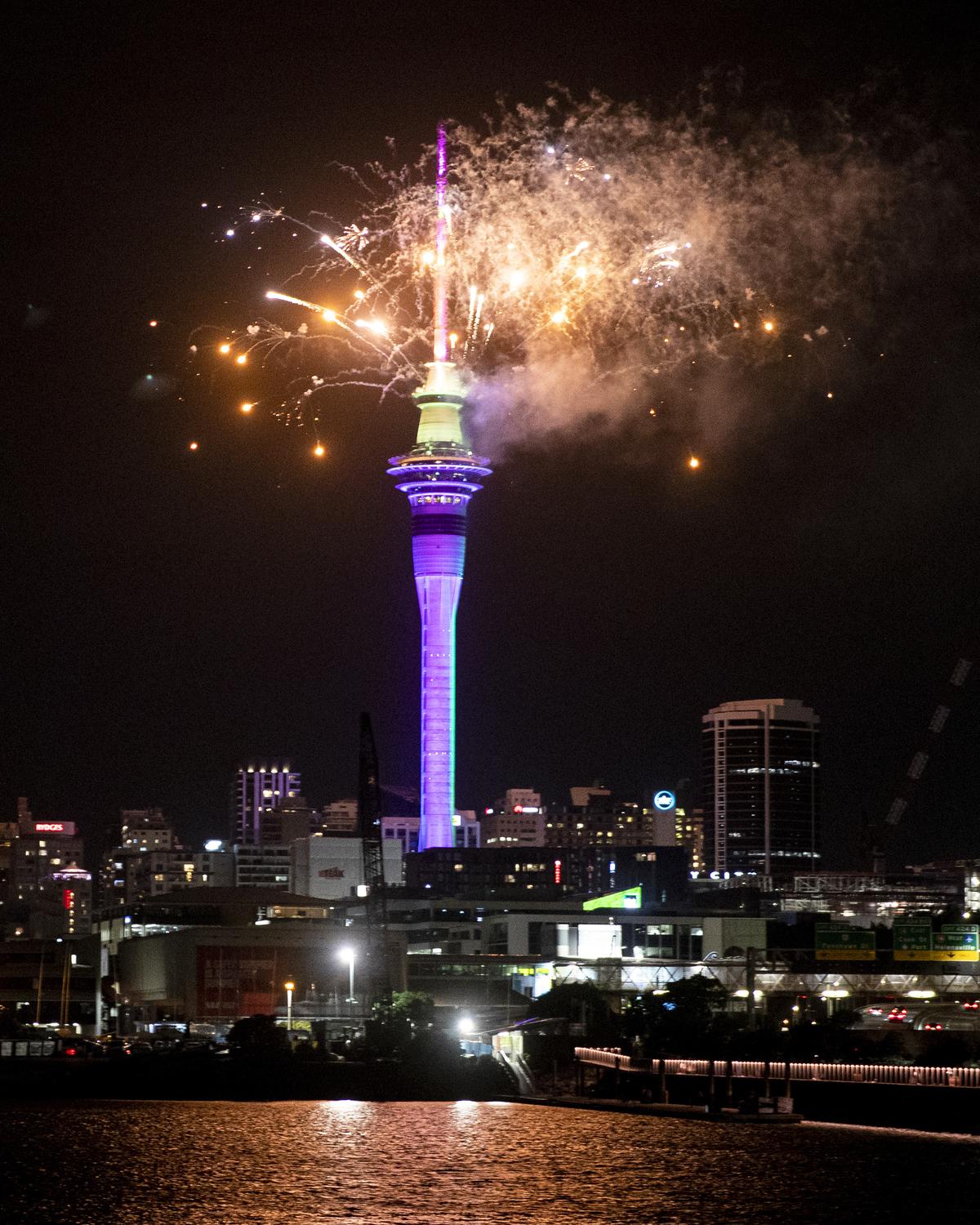 Fireworks explode over Sky Tower in central Auckland as New Year celebrations begin in New Zealand, Sunday, Jan. 1, 2023. 