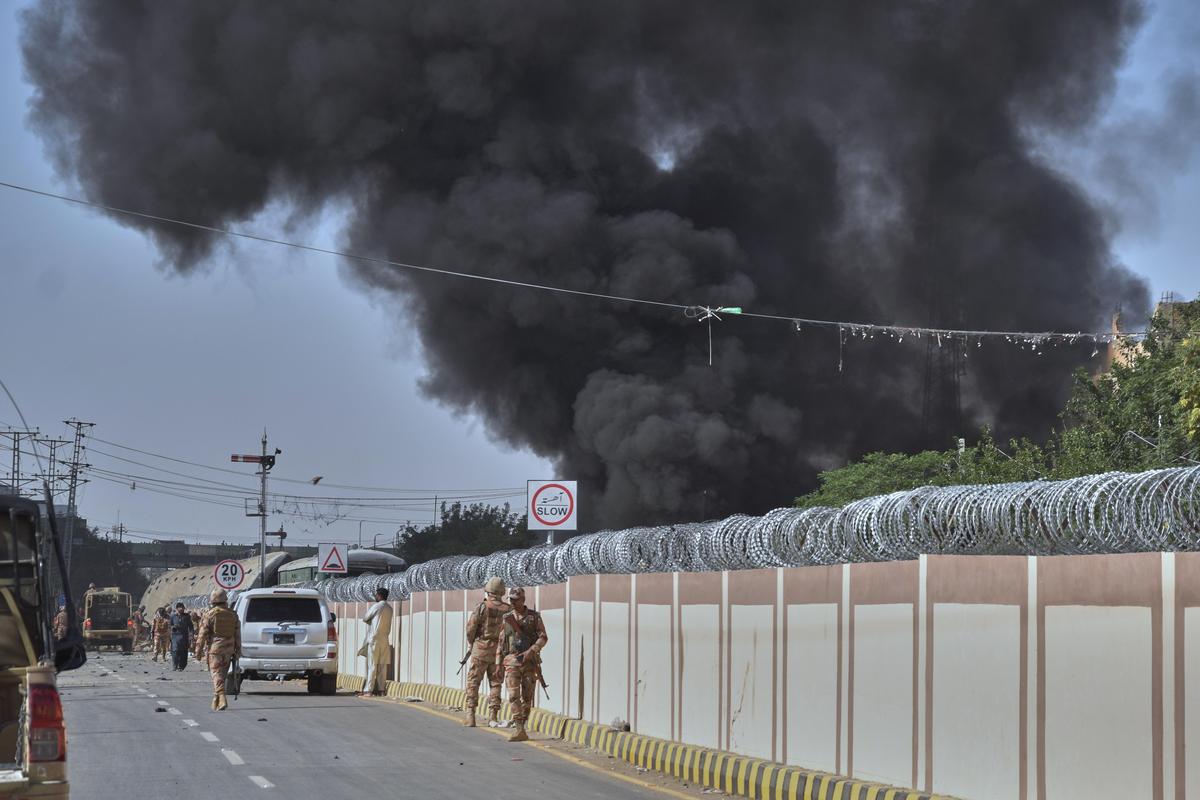 Pakistani paramilitary soldiers secure a road as smoke rise from the site of bomb explosion, in Quetta, Pakistan, on Sunday, May 24, 2026.