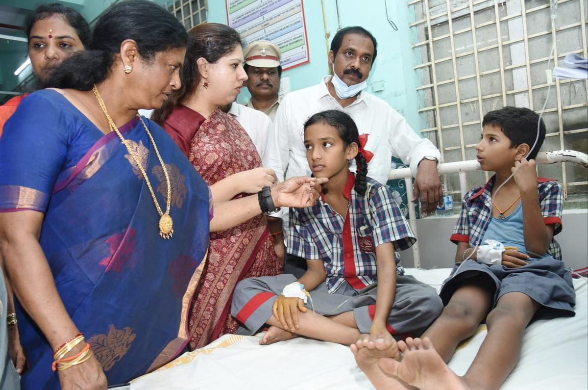 MP V. Geetha and MLA K. Kannababu interacting with the Kendriya Vidyalaya students at the government hospital in Kakinada on Tuesday.