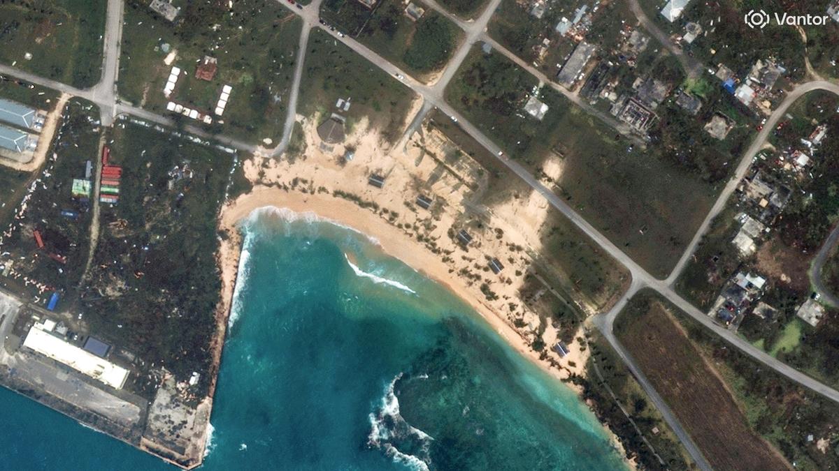 Searchers find body of 1 of 6 missing crew members from ship that overturned during typhoon