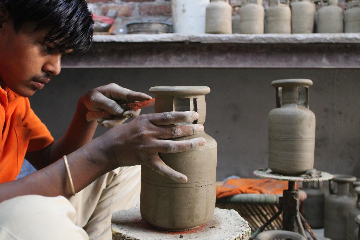 A potter at work inside his home in Delhi's Kumhar Gram in Uttam Nagar A potter at work inside his home in Delhi's Kumhar Gram in Uttam Nagar