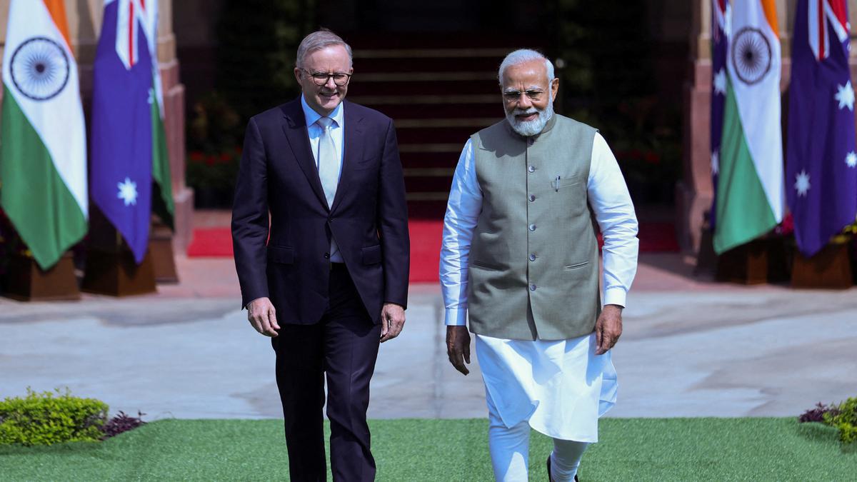 Australian Prime Minister Anthony Albanese and his Indian counterpart Narendra Modi arrive to attend a photo opportunity. | Photo Credit: Reuters