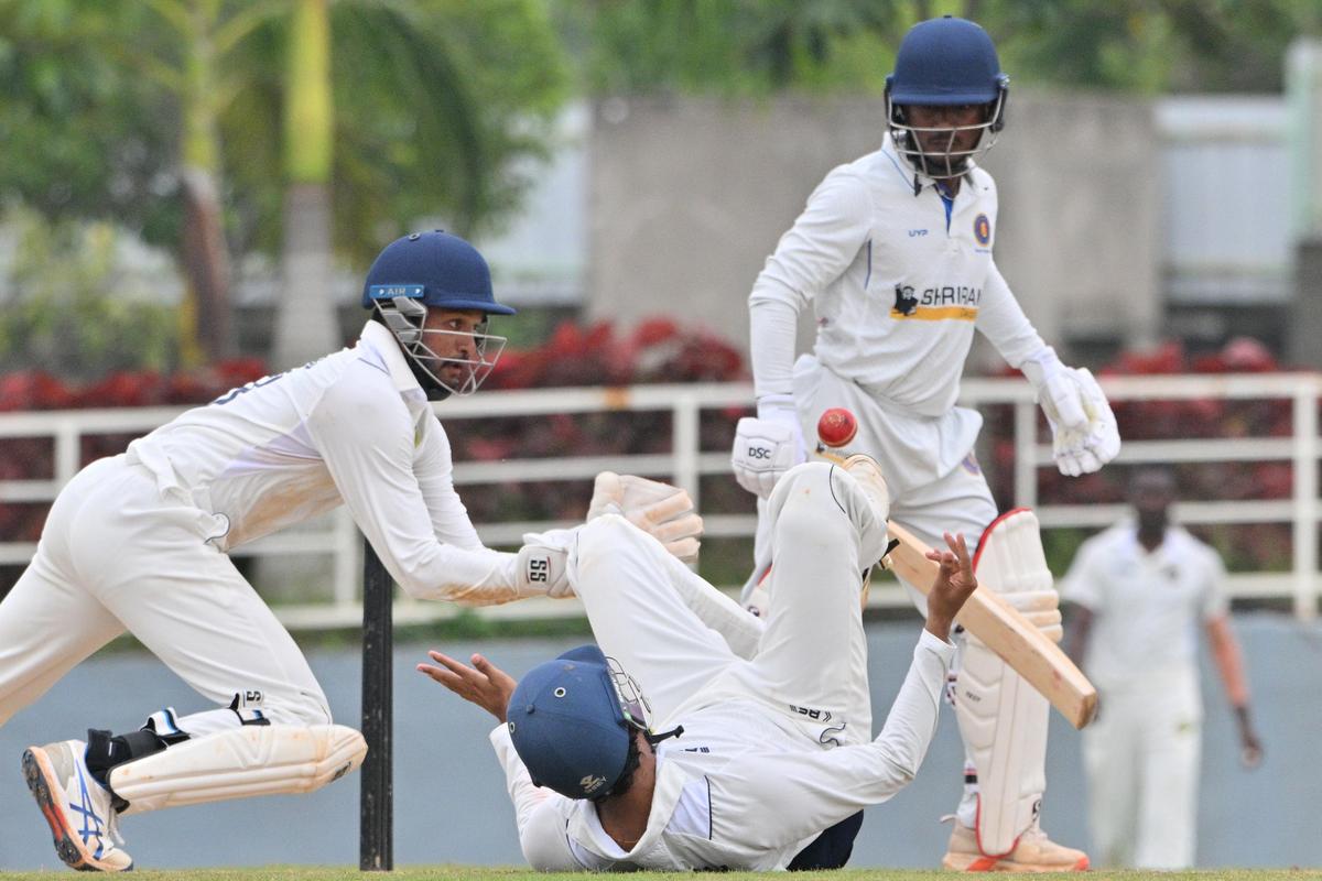 Hyderabad wicket-keeper Rahul dives to complete the catch to dismiss Ganga.