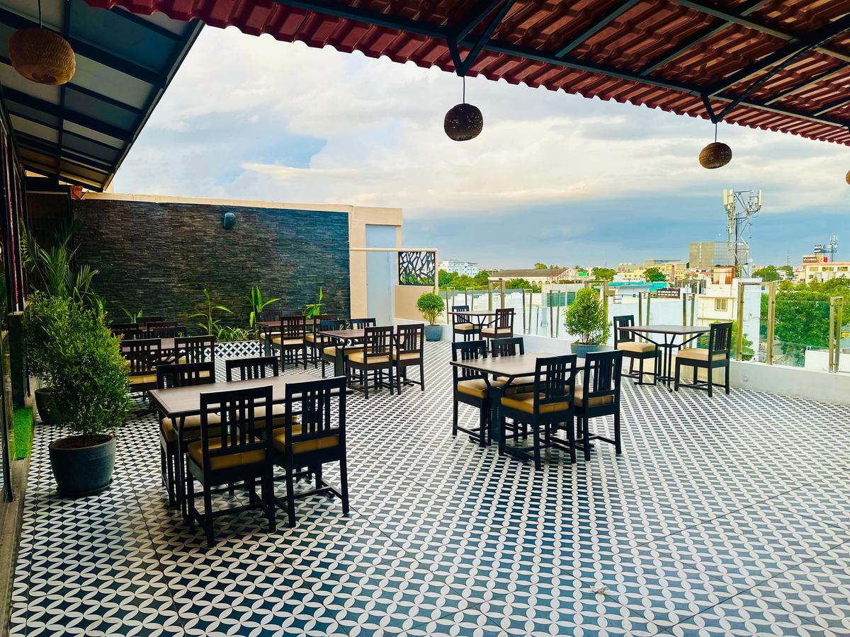 Outdoor seating opens to the views of the Avinashi Road flyover