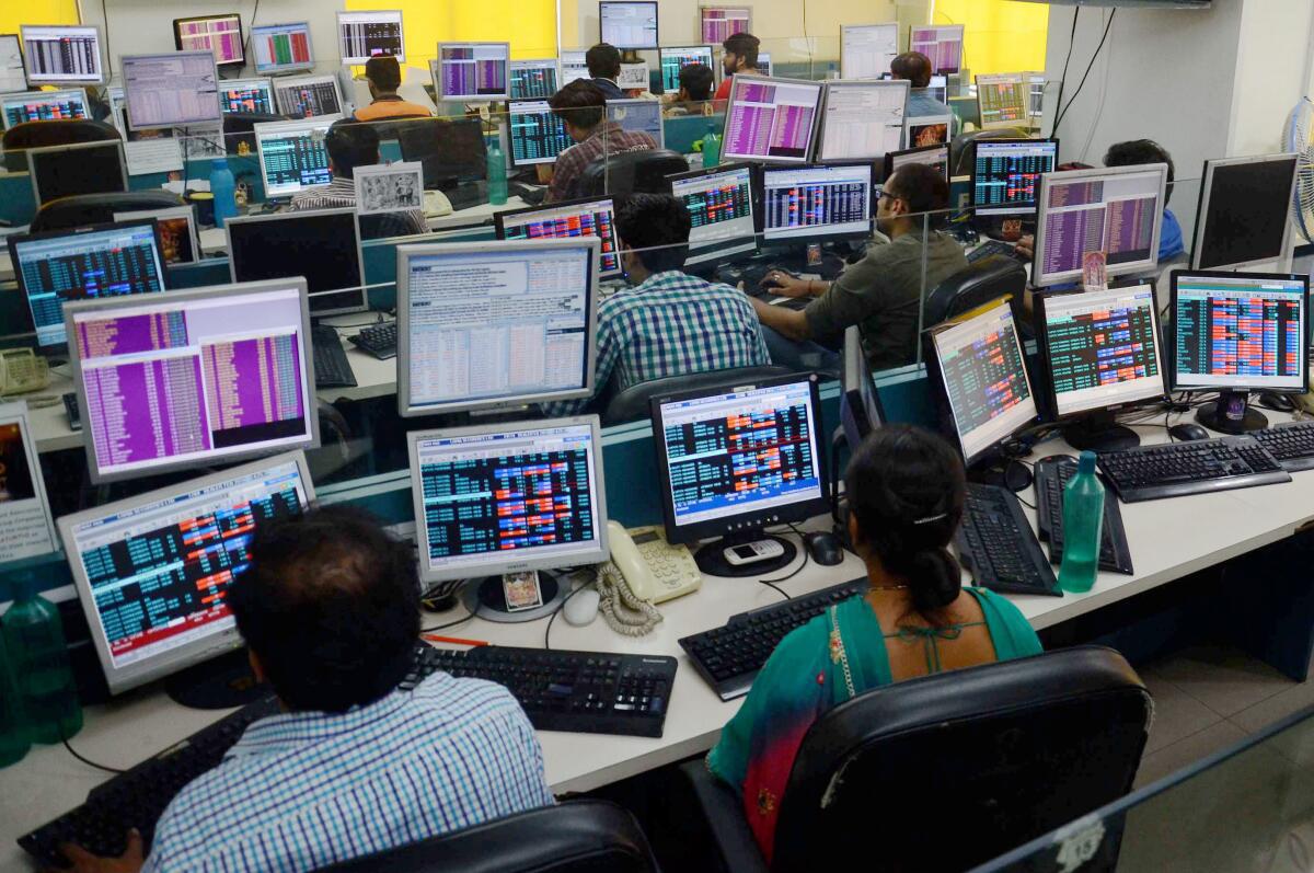 Kolkata: Share brokers watching stock prices fall at BSE Sensex and NSE Nifty at Calcutta Stock Exchange in Kolkata