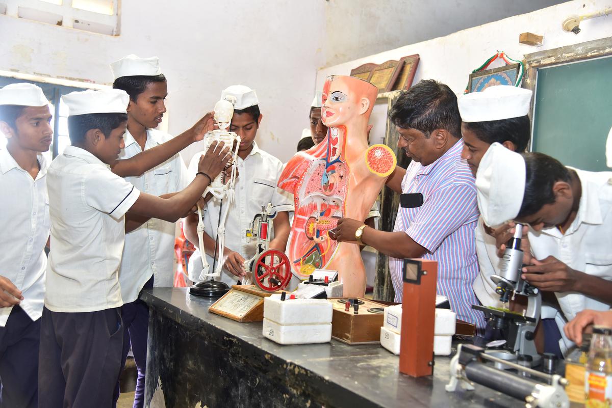 
The students of Gandhi Grameen Gurukul Residential School looking at models in their science laboratory.  