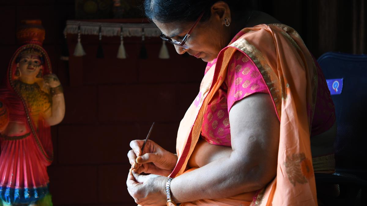 Watch | This woman writes 108 letters on a grain of rice