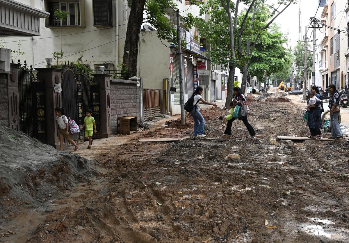 Rain has made it difficult for people to cross this road at Chamarajpet in Bengaluru, where civic works have been taken up. Rain has made it difficult for people to cross this road at Chamarajpet in Bengaluru, where civic works have been taken up.