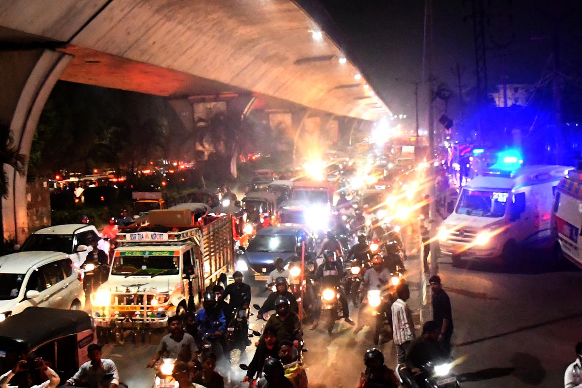 Traffic comes to a halt in Jyothinagar area near Gudimalkapur on Saturday evening due to a fire mishap at Ankura Hospital in Hyderabad on Saturday.