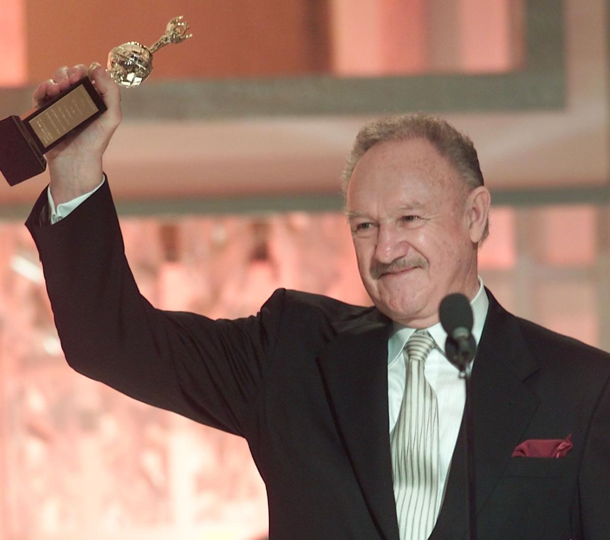 Gene Hackman holds the Cecil B. DeMille award presented to him by the Hollywood Foreign Press Association for his “outstanding contribution to the entertainment field” during the 60th annual Golden Globe Awards in Beverly Hills, January 19, 2003.