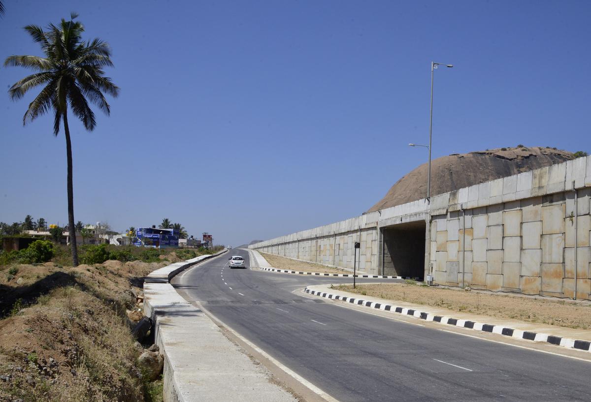 An underpass that connects service roads on either side of the highway.