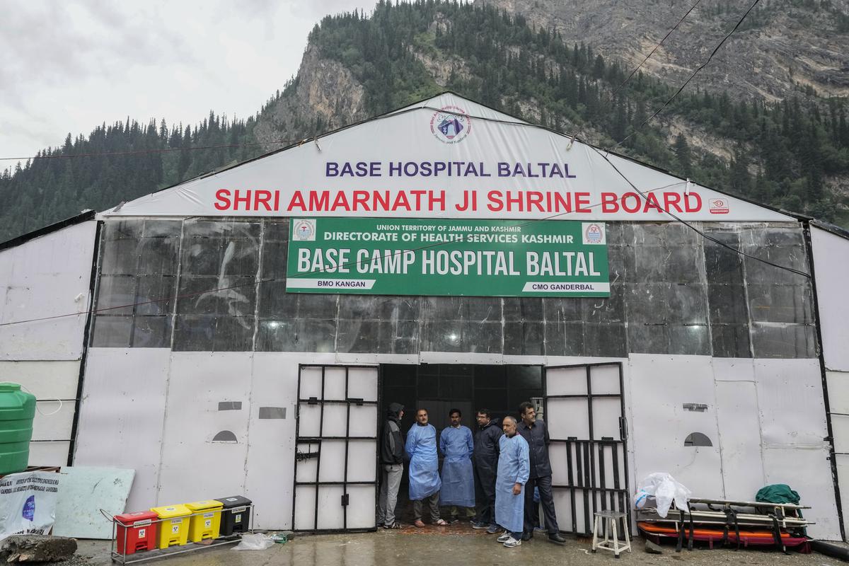 Paramedics wait for injured pilgrims, at Baltal, after the flash flood.