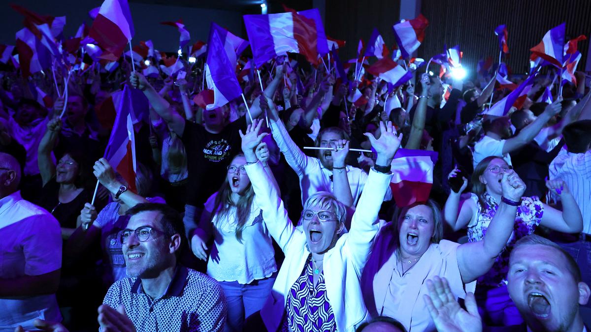 Far-right National Rally leads first voting round of French parliament elections – exit polls