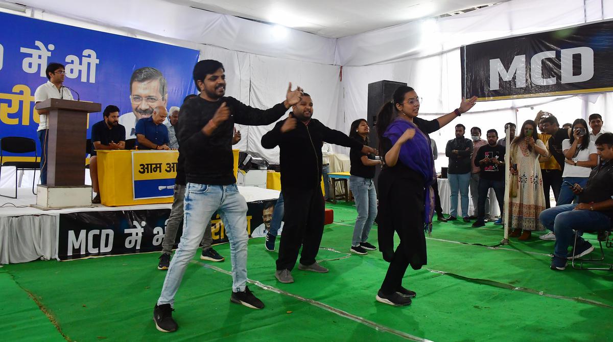 AAP volunteers perform during the launch of Aam Aadmi Party's 'theme song' for the upcoming MCD election campaign, in Delhi on Tuesday.  Deputy CM Manish Sisodia and other party leaders were also present.