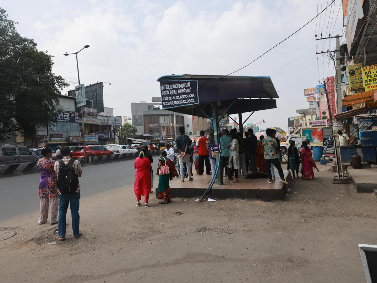 No seating at the Camp Road Junction bus stop in Selaitur on Tambaram Velachery Main Road. 
The image was taken on February 1, 2026.