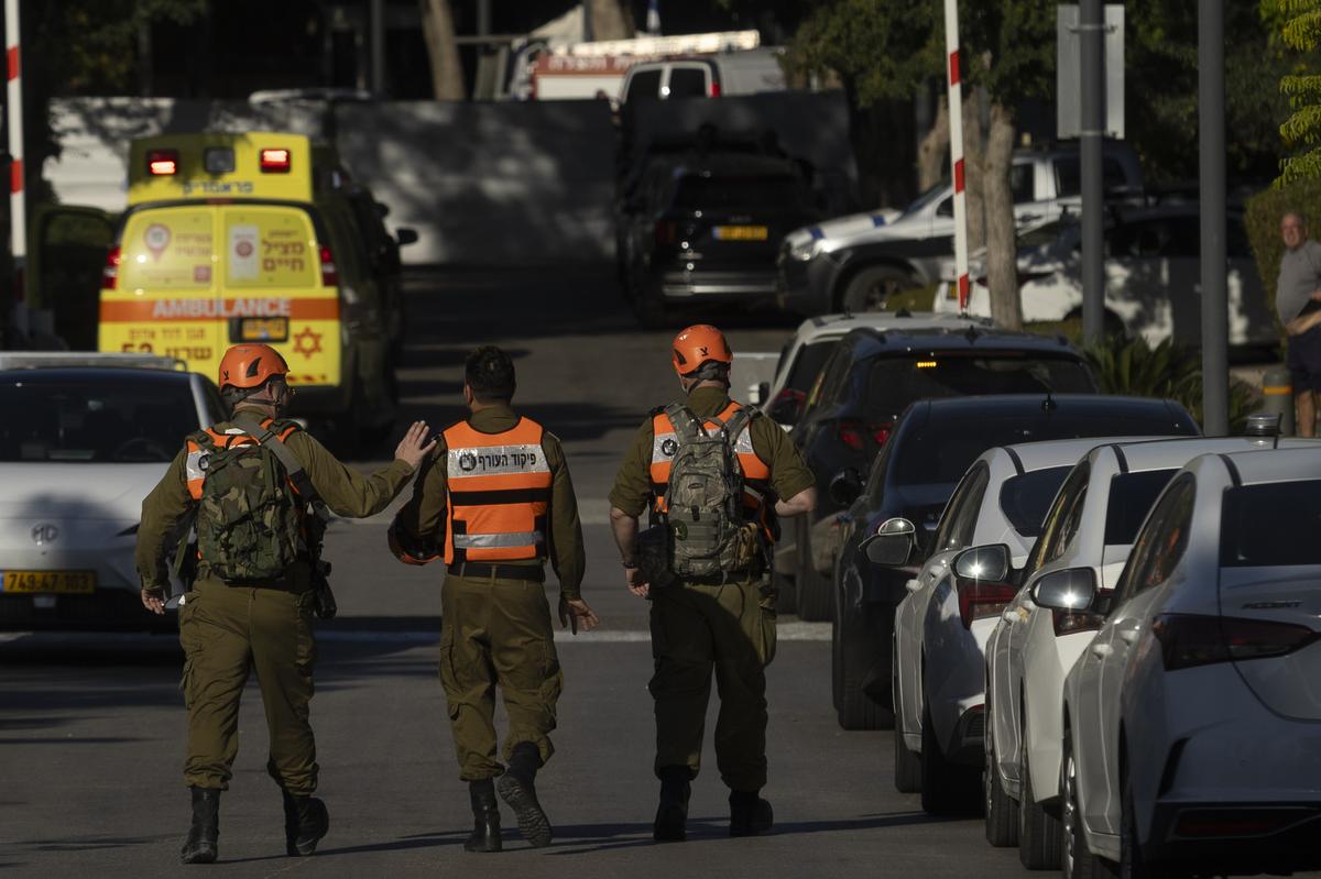 Israeli emergency workers attend the scene after a drone reportedly fired from Lebanon hit a structure on October 19, 2024 in Caesarea, Israel. 