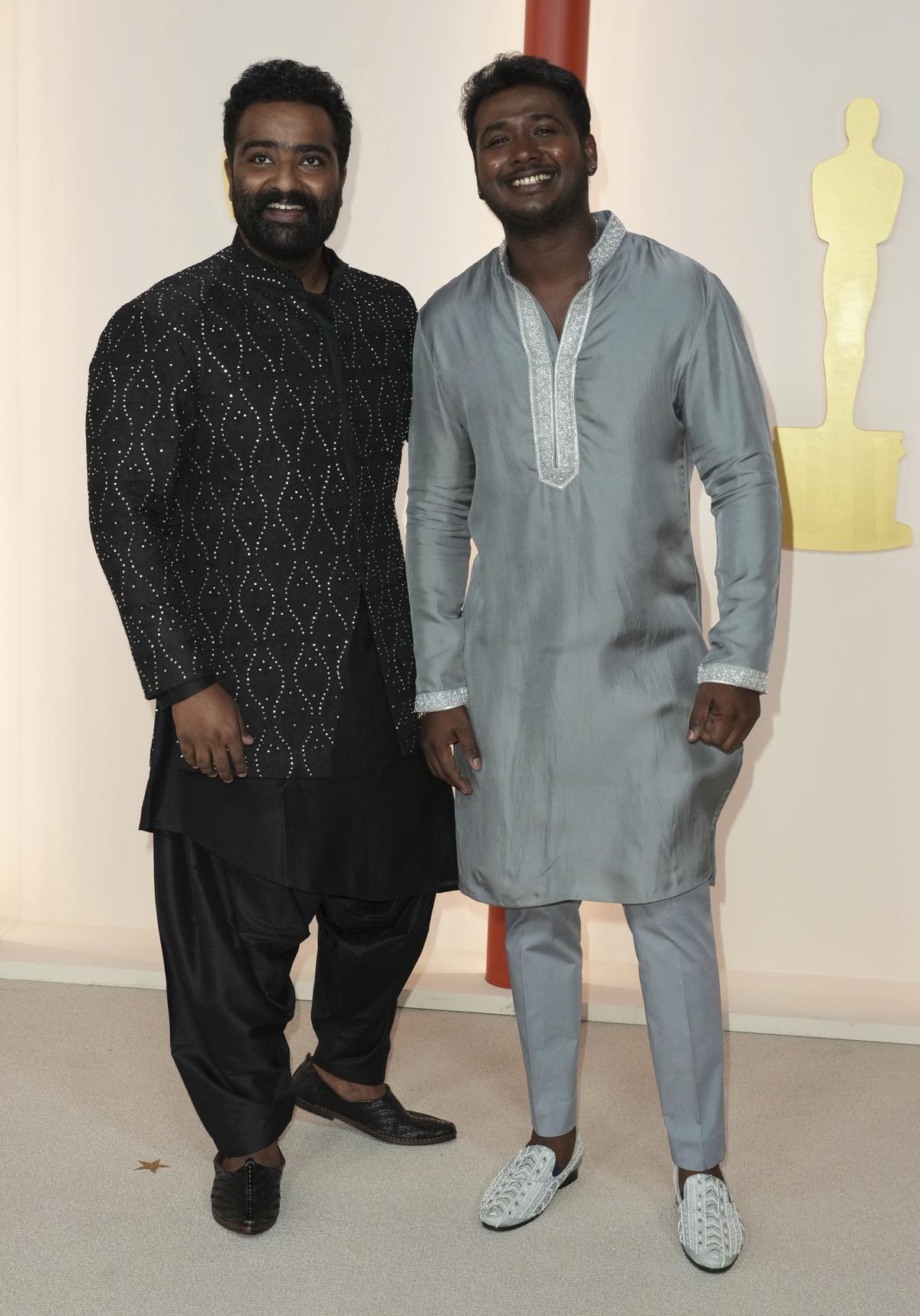 Kaala Bhairava, left, and Rahul Sipligunj arrive at the Oscars on Sunday, March 12, 2023, at the Dolby Theatre in Los Angeles