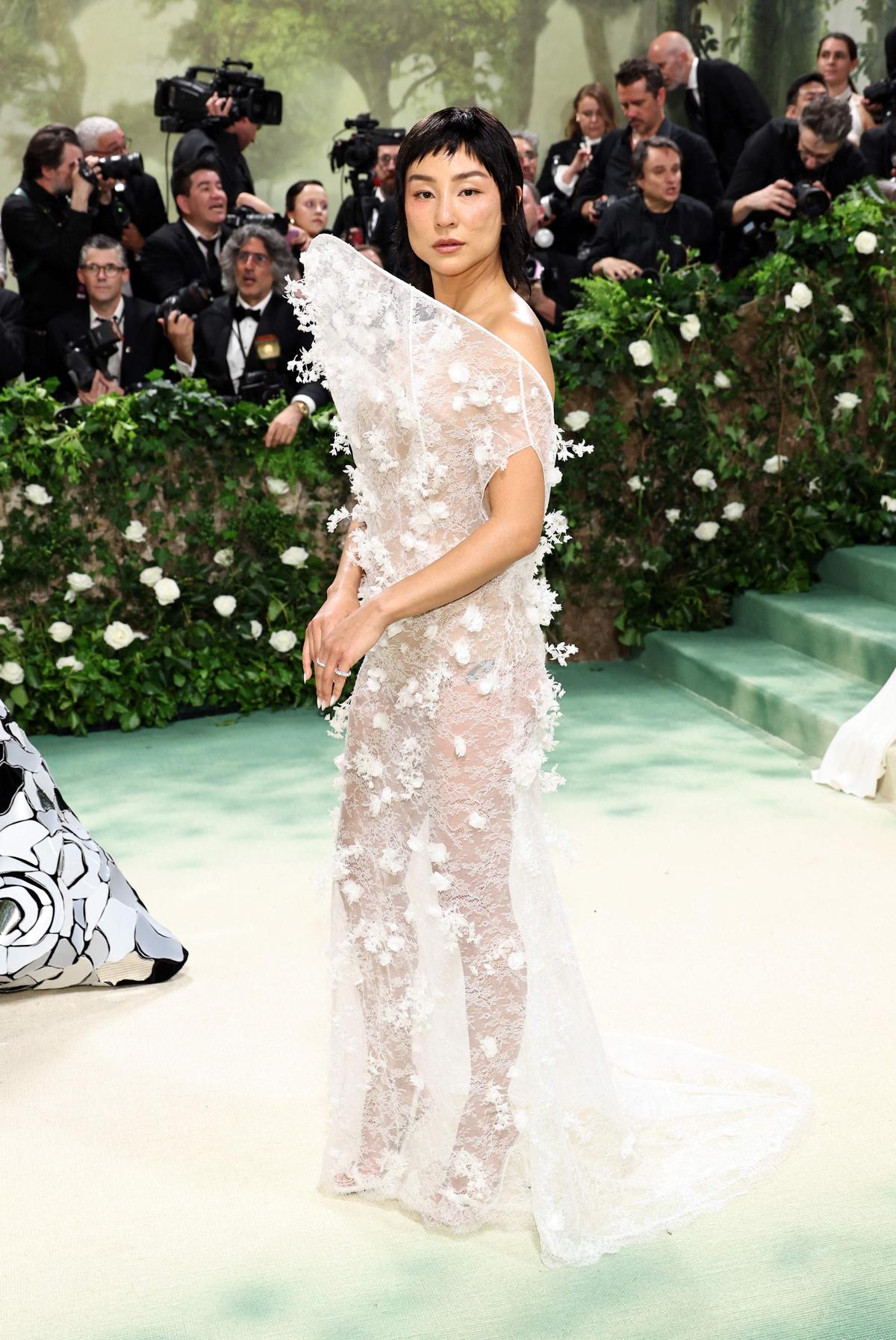 Greta Lee posing at the Met Gala