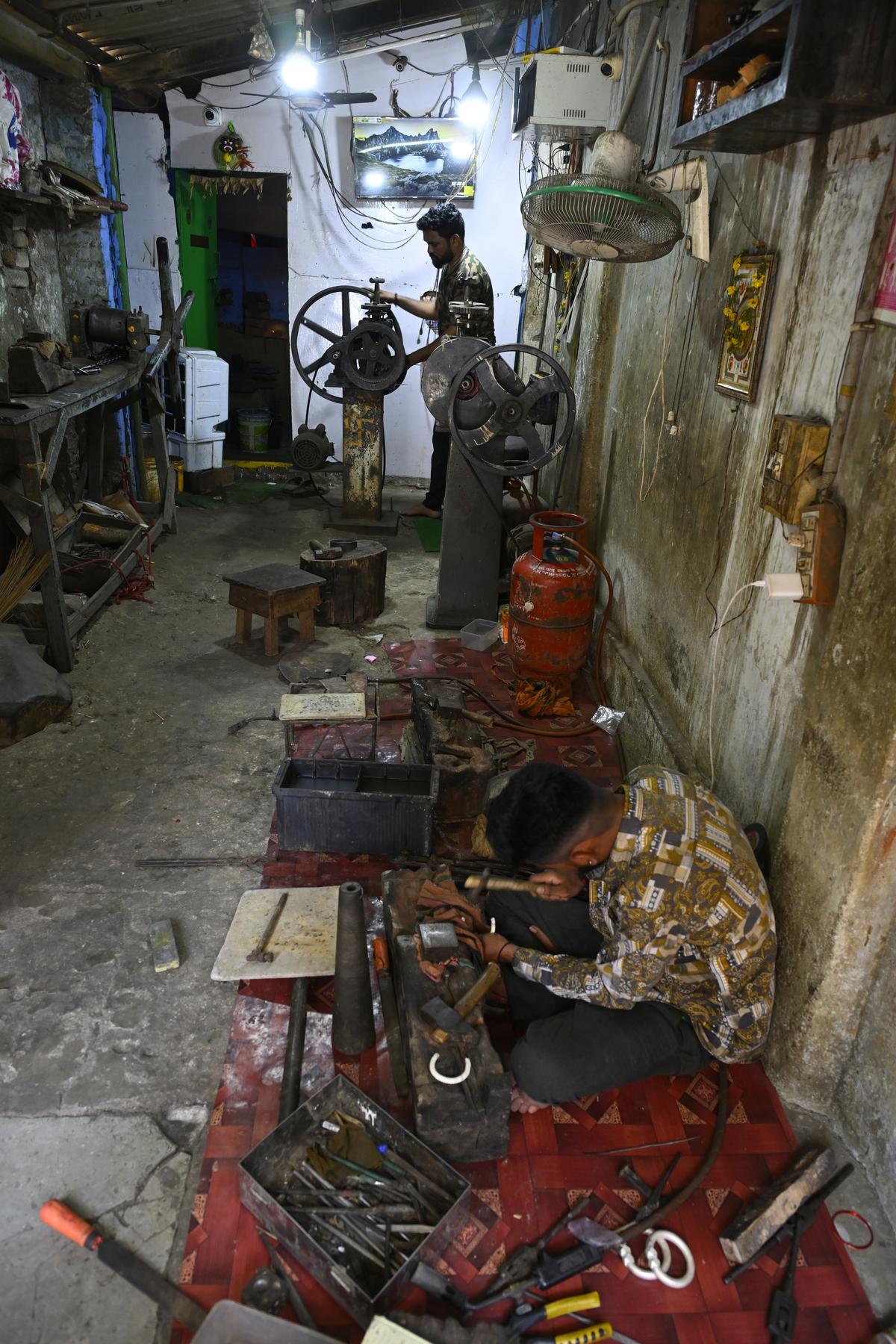Goldsmiths working hard to make both ends meet by working at Vishwakarma street where hundreds of gold shops are located in Warangal. Goldsmiths working hard to make both ends meet by working at Vishwakarma street where hundreds of gold shops are located in Warangal.