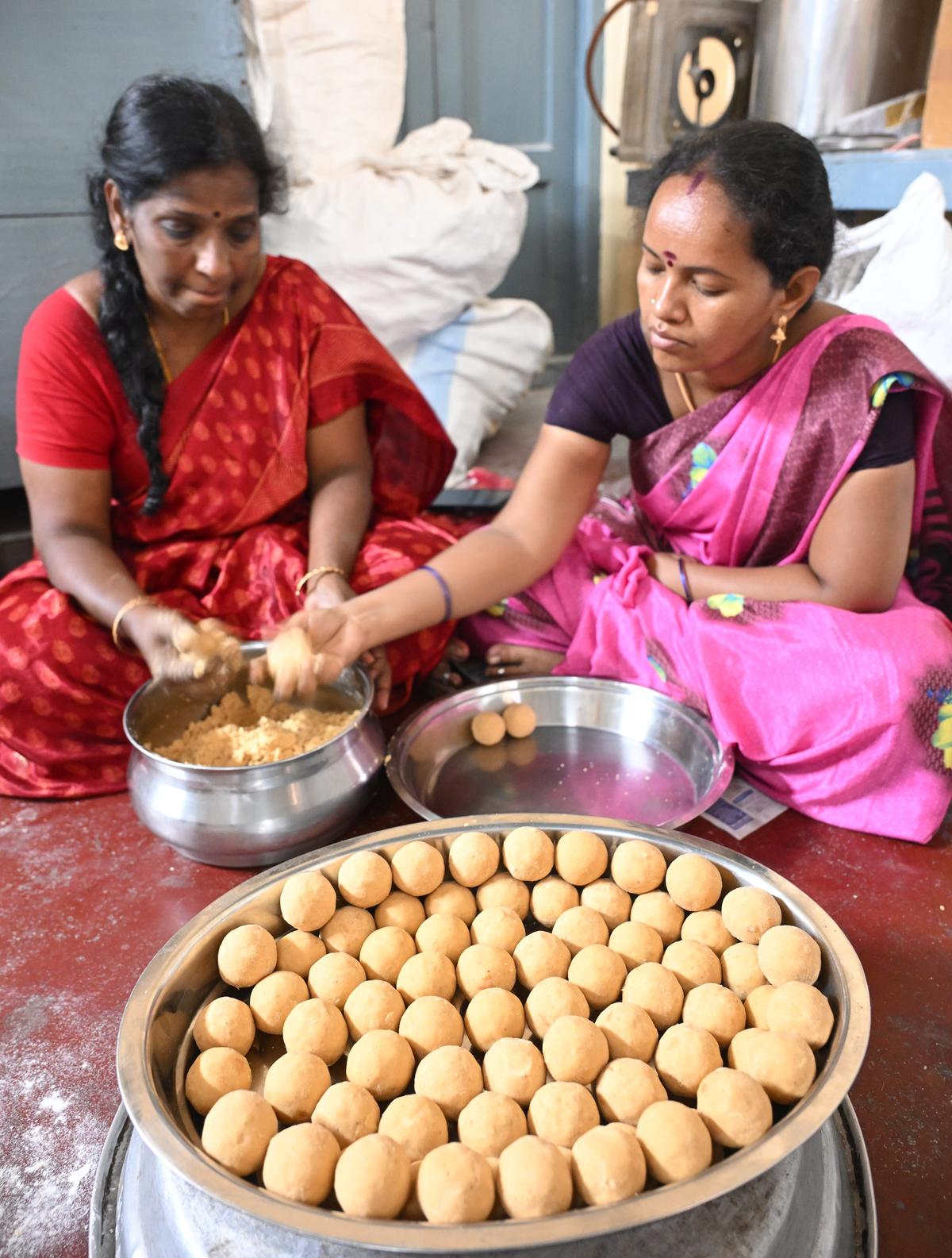 Vijayalakshmi’s assistants carefully moulding her signature maladu sweet in Madurai.  Vijayalakshmi’s assistants carefully moulding her signature maladu sweet in Madurai.