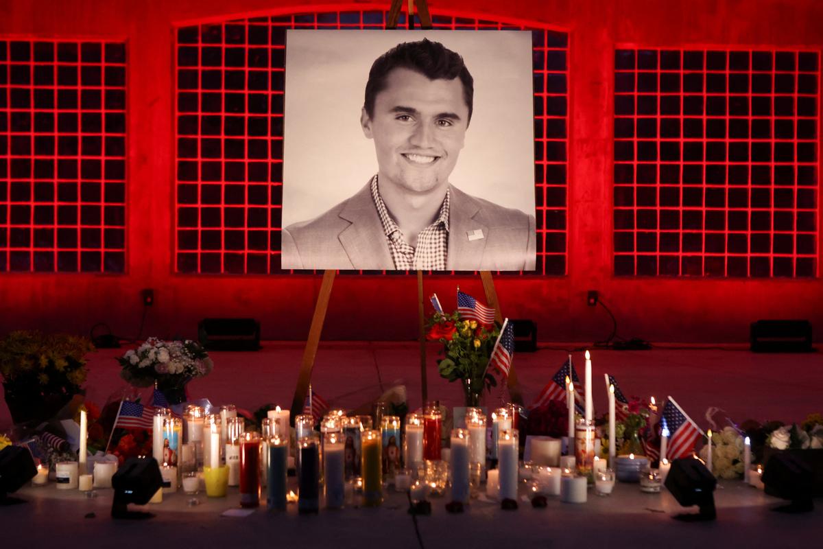 Candles and flowers are placed near an image of Charlie Kirk, during a vigil at Orem City Center Park, after U.S. right-wing activist and commentator, Charlie Kirk, an ally of U.S. President Donald Trump, was fatally shot during an event at Utah Valley University