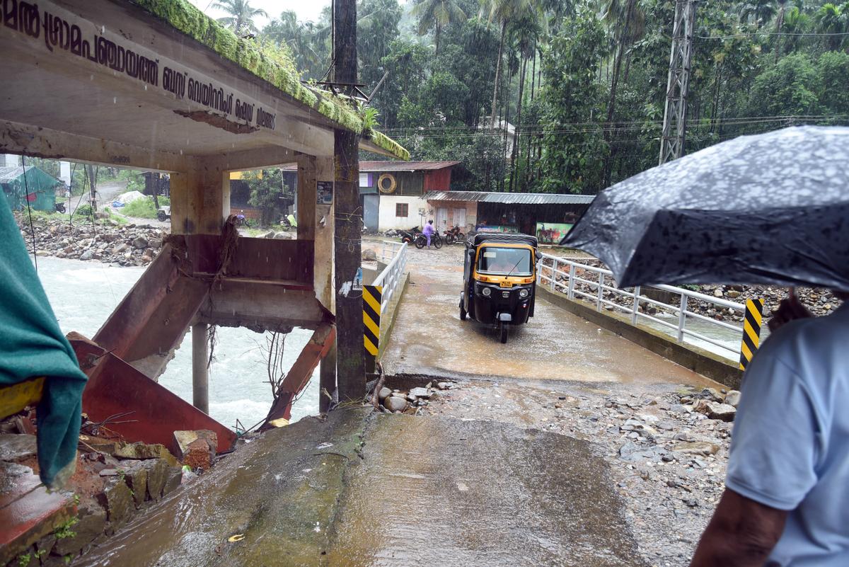 The Valook bridge in Vilangad town and the skeleton of the bus waiting shed that was damaged in the landslide a year ago.