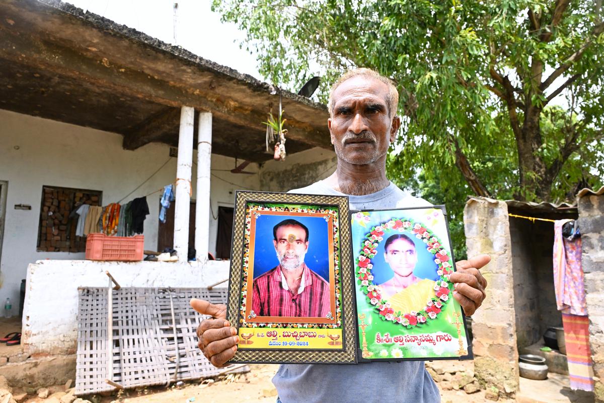 A. Appalasuri, a resident of Bhadrayyapeta, showing the pictures of his brother and sister-in-law who, he says, died due to kidney-related ailments.