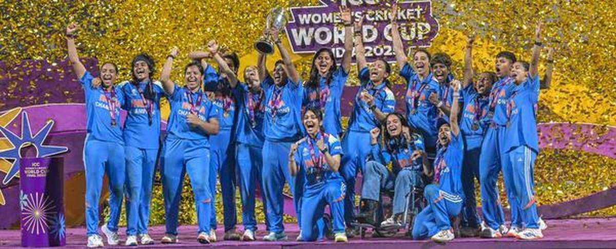Indian players celebrate with the World Cup. Indian players celebrate with the World Cup.