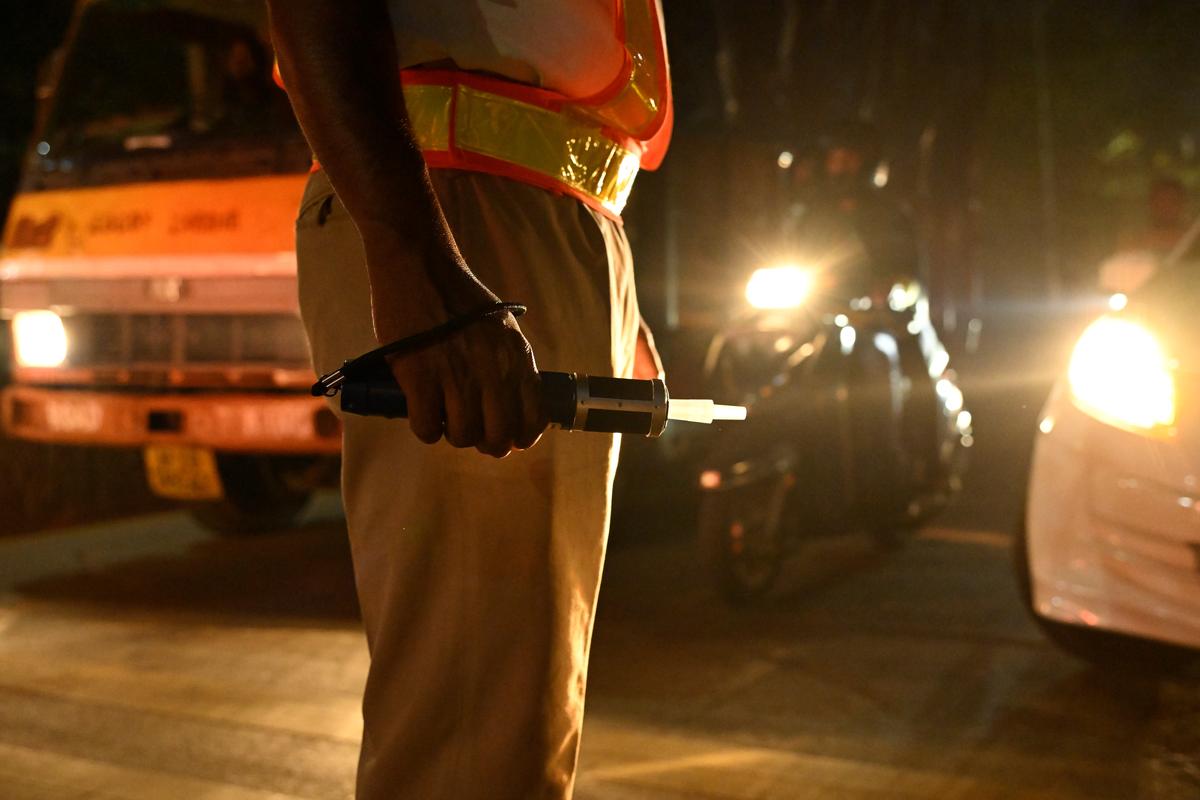 Traffic police personnel conducting checks to detect drunk driving, as part of the measures for a safe New Year’s Eve, at RP road in Hyderabad on Tuesday (December 31, 2024).
