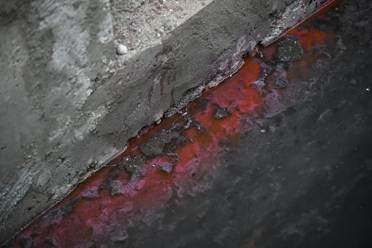 Water flowing through a drainage at Punnakkatt lane near Edappally railway station gets mixed with residues from a dye-making unit left in the soil in the area even after 44 year since the factory was closed. 