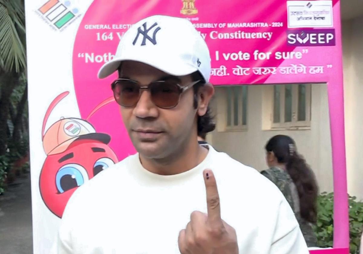 Actor Rajkummar Rao shows his finger marked with indelible ink after casting vote during the Maharashtra Assembly elections, in Mumbai