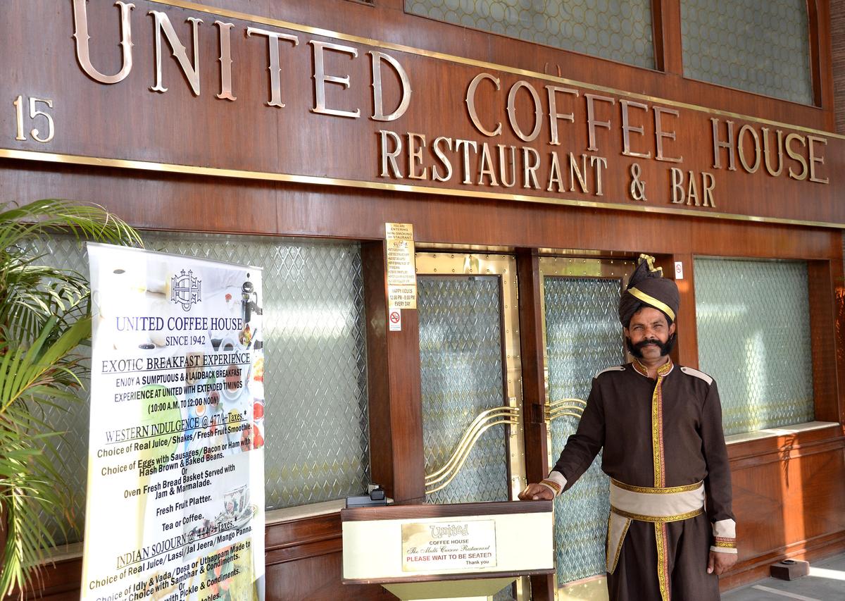 Gatekeeper at the seventy-year-old United Coffee House at Connaught Place in New Delhi on May 02, 2011. Gatekeeper at the seventy-year-old United Coffee House at Connaught Place in New Delhi on May 02, 2011.