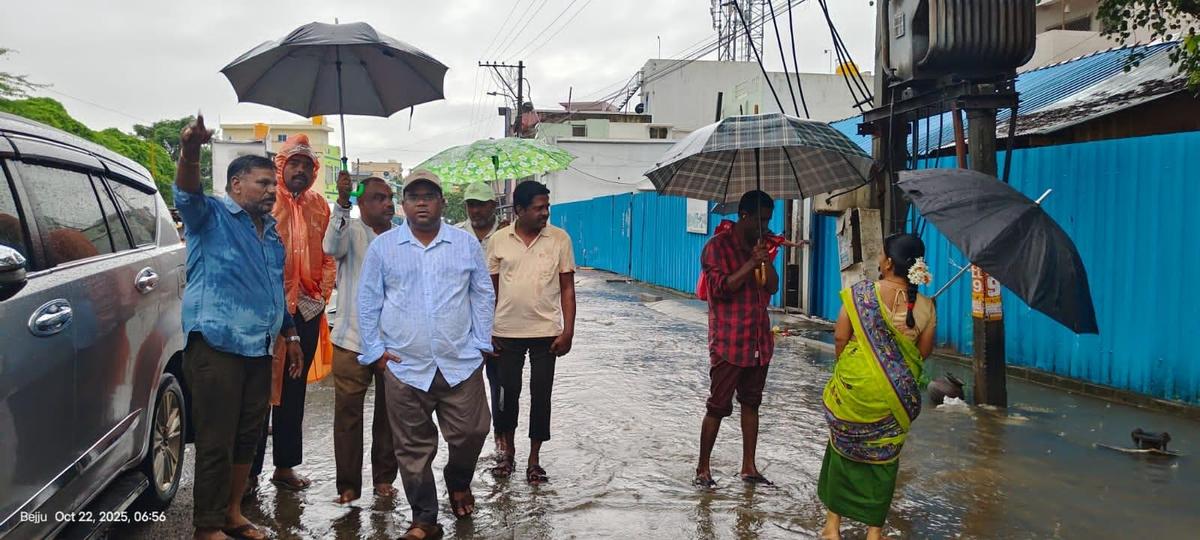 Municipal officials inspect a low-lying residential area at Thotapalem, close to the Neeva river in Chittoor on October 22, 2025. Photo: Special Arrangement