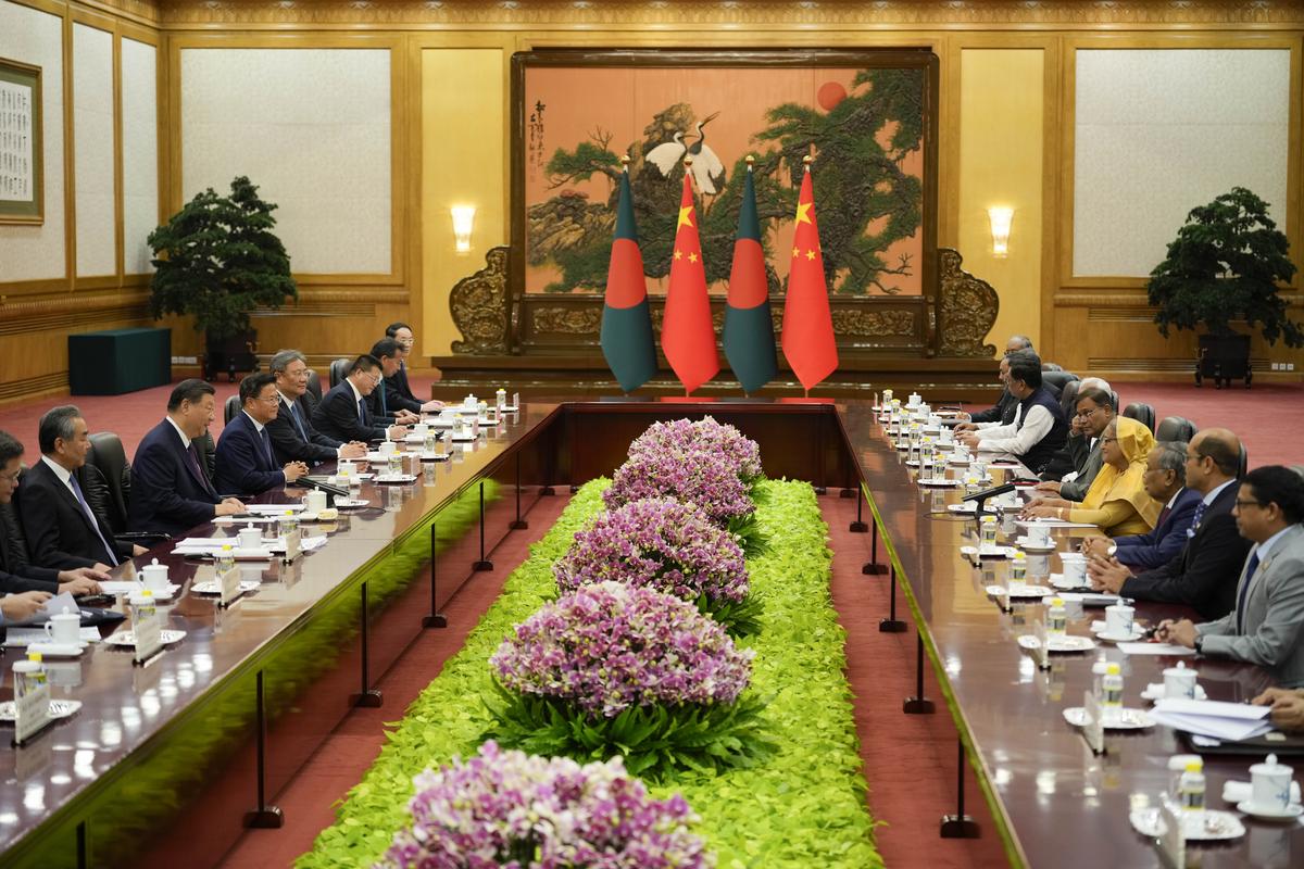 Chinese President Xi Jinping, second from left, and his delegation attend a meeting with Bangladesh Prime Minister Sheikh Hasina, fourth from right, at the Great Hall of the People in Beijing, China on July 10, 2024. 