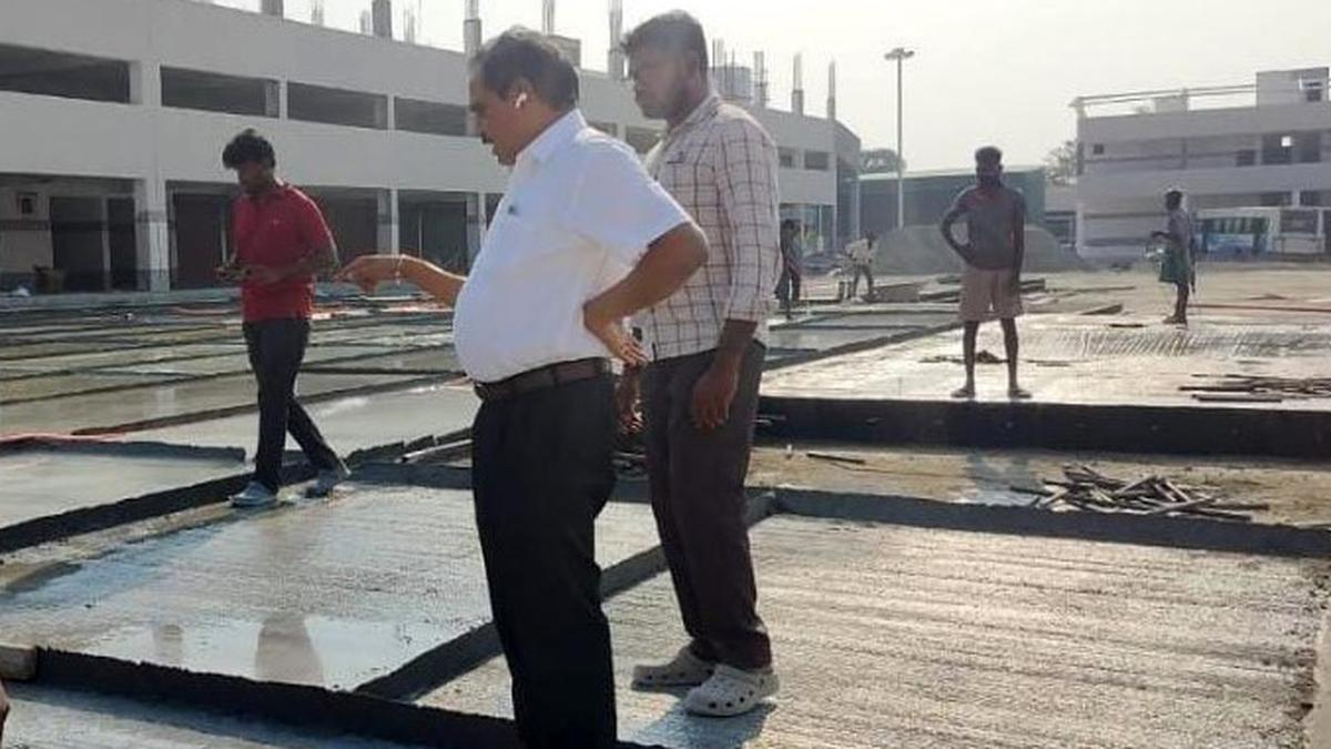 Cement concrete flooring under way at Kovil Vazhi Bus Stand  in Tiruppur with additional funding