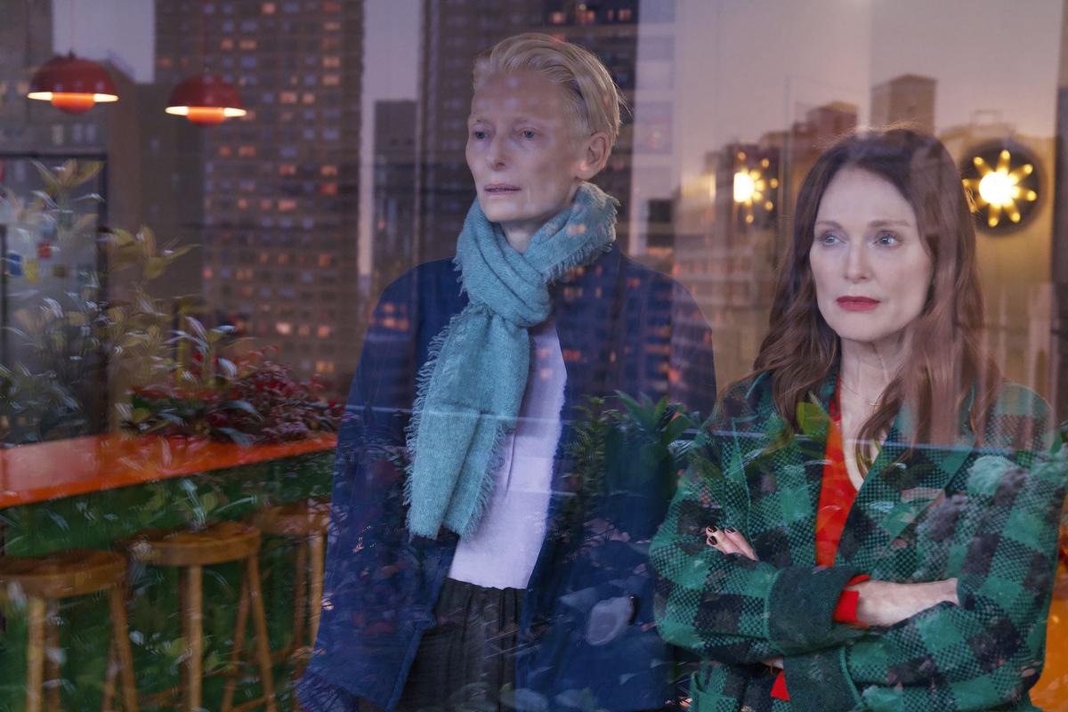 This image released by Sony Pictures Classics shows Julianne Moore, right, and Tilda Swinton in a scene from ‘The Room Next Door’