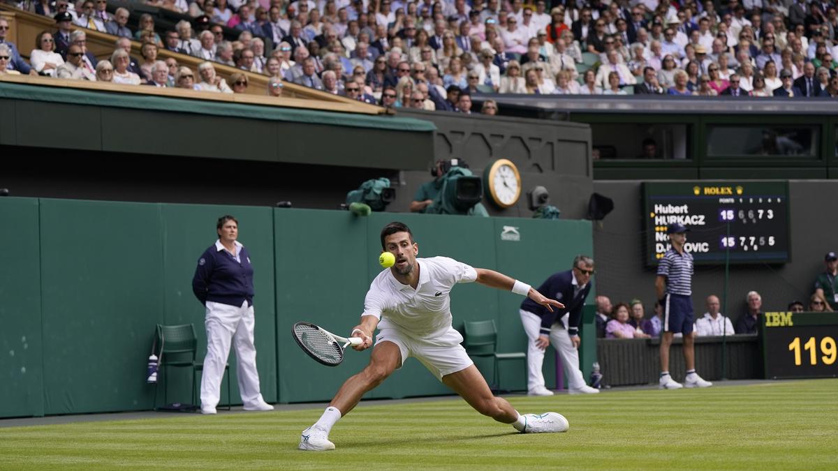 Novak Djokovic plays at Wimbledon with the number ''23'' printed on his  white tennis shoes - The Hindu
